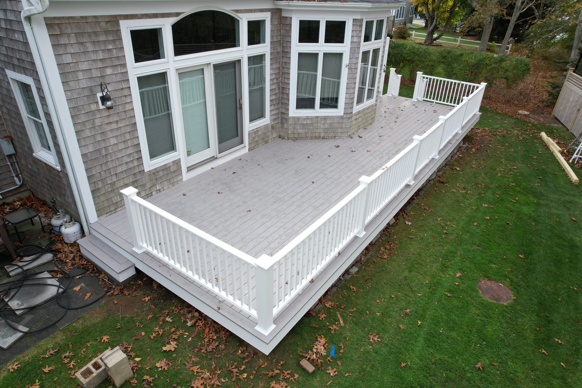 Two-story deck with under-deck storage — HyTech Roofing, Cape Cod